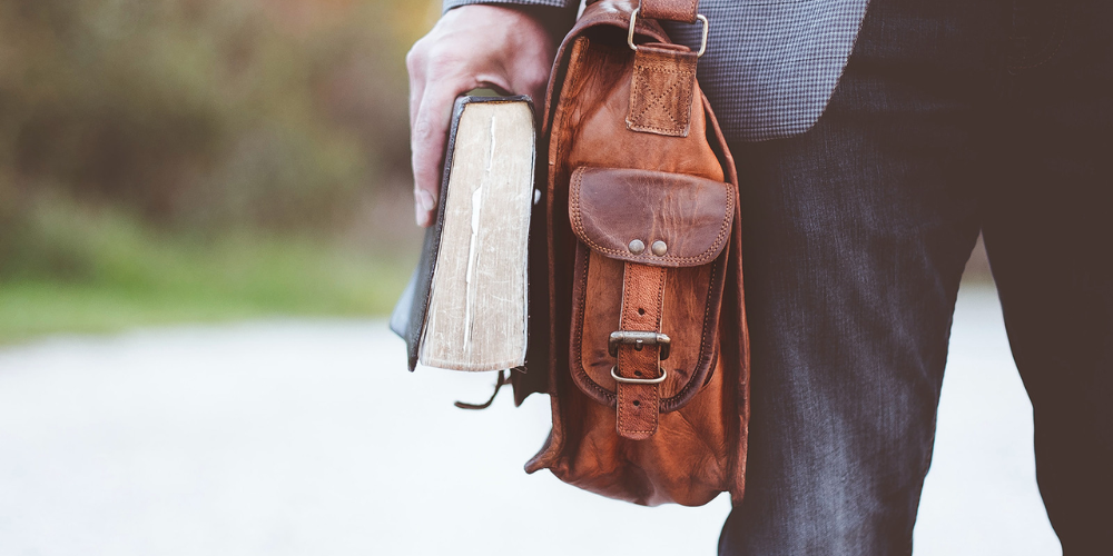 A bucket bag is shaped like a bucket, usually has an open top and shoulder strap.